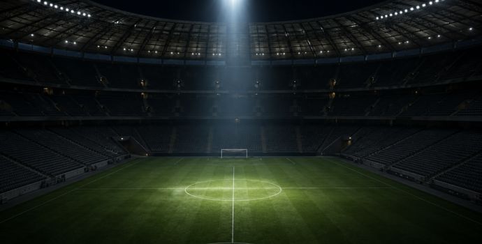 "Empty soccer stadium at night with a single spotlight on the center circle, reflecting the end of a World Cup run"