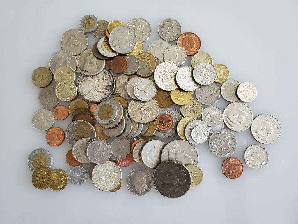 Coins in jar showing savings growth over time