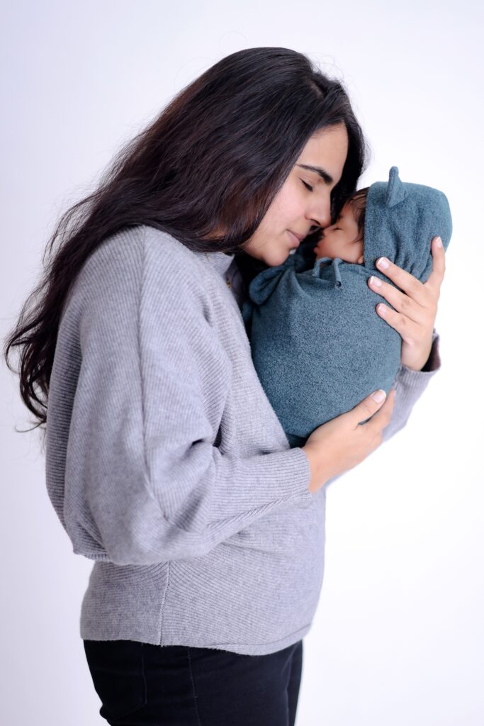 Clumps of hair in a brush showing peak postpartum hair loss around month four to six